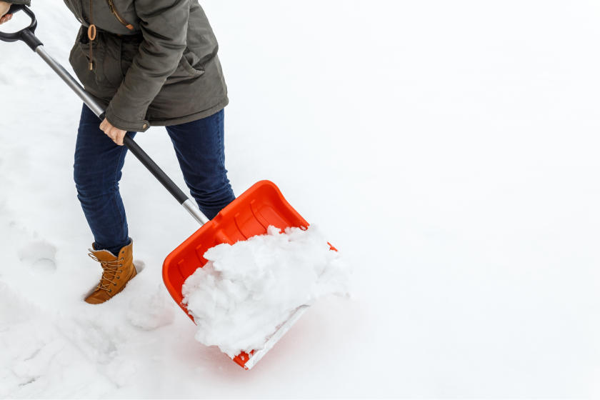 woman shoveling snow 840x560 75